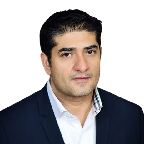 Business portrait of Mickel Mirchandani in a formal suit.